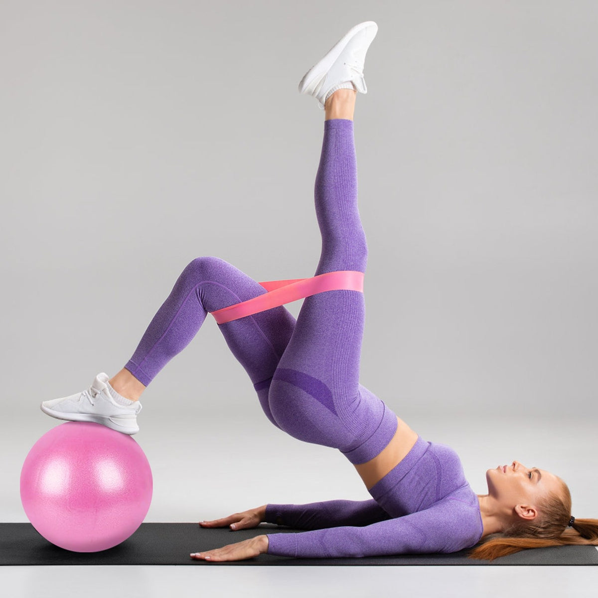 Glute bridge with the exercise ball and loop band
